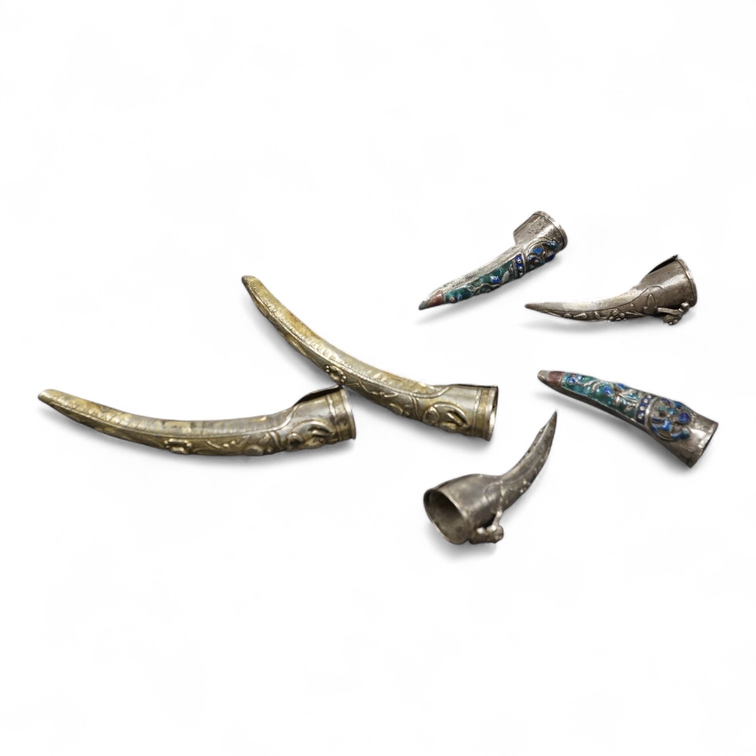 Three pairs of Chinese silver finger guards, 19th century, longest 8.5cm. Condition - good